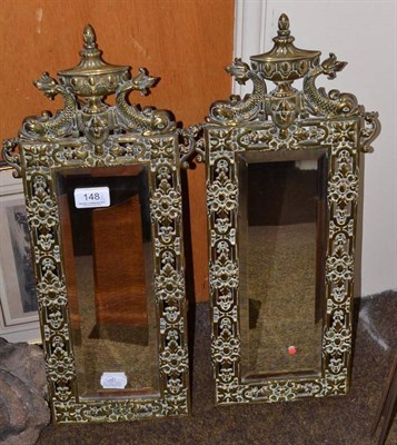Lot 148 - Pair of brass mounted wall mirrors