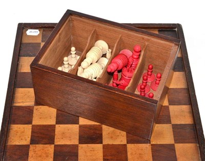 Lot 169 - A carved and stained bone chess set (Barley Corn pattern) in a mahogany case with board