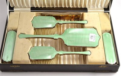Lot 176 - A silver and green guilloché enamel mounted dressing table set (cased)