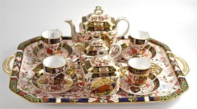 Lot 183 - A late 19th century Crown Derby tete-a-tete, decorated in Imari colours highlighted in gilt,...