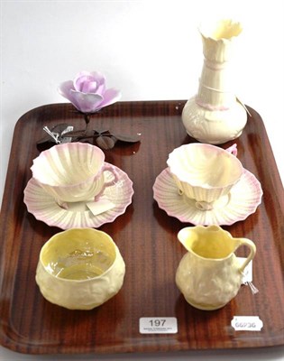 Lot 197 - A pair of Belleek Neptune cups and saucers (second black mark), a Belleek cream jug, sugar...