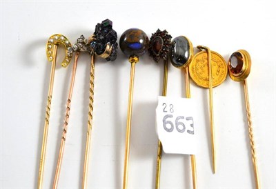 Lot 222 - A collection of eight stick pins
