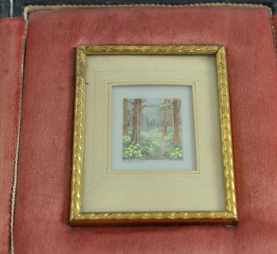 Lot 227 - A miniature painting on glass depicting a forest scene, signed S A Burchem, in fitted case