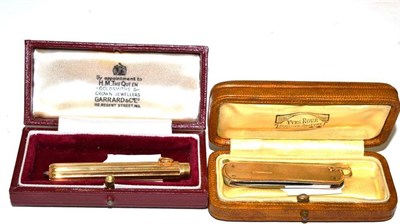 Lot 240 - A pen knife with 9ct gold scales and suspension loop, also a French 18ct gold 'propelling'...