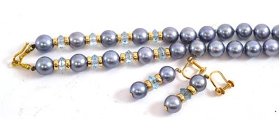 Lot 241 - A cultured pearl and blue topaz necklace and earring set