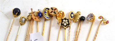 Lot 257 - A collection of fifteen stick pins