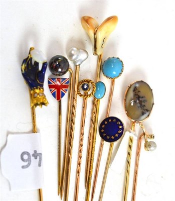 Lot 261 - A collection of eleven stick pins