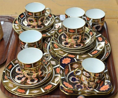 Lot 270 - A Royal Crown Derby part tea service of seven cups, seven saucers, two square dishes and a...