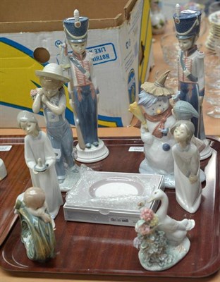 Lot 286 - Eight Lladro figures and a Lladro plate