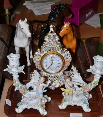 Lot 290 - A flower encrusted clock; a pair of German porcelain candlesticks and four Beswick horses (one with