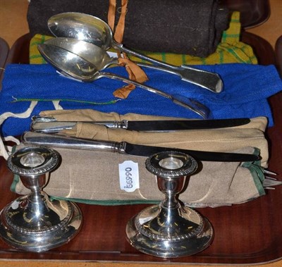 Lot 298 - Pair of silver squat candlesticks and a quantity of plated flatware