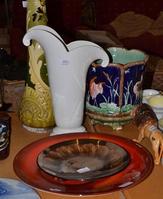 Lot 302 - Two Poole pottery chargers, Beswick lion, majolica planter, Bretby vase and a Woods vase