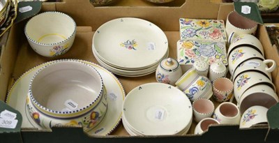 Lot 309 - A tray of Poole pottery including tea set, cigarette boxes and covers, table condiments, mug etc