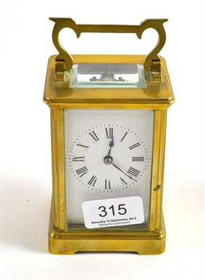 Lot 315 - A brass striking mantel clock