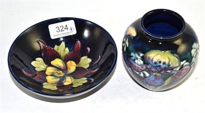 Lot 324 - Walter Moorcroft Orchid and Spring Flowers vase and a Walter Moorcroft bowl (2)