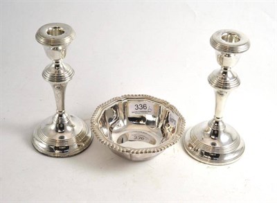 Lot 336 - Pair of silver candlesticks, Birmingham hallmarks and a silver deep fluted dish, Sheffield...