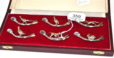 Lot 359 - A cased set of six hallmarked napkin rings