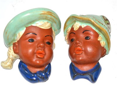 Lot 361 - A pair of Goldscheider wall masks impressed 8814 depicting a young boy and girl