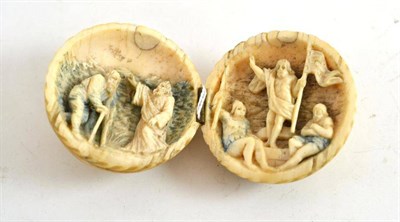 Lot 365 - A carved bone Prisoner of War ball with religious reliefs