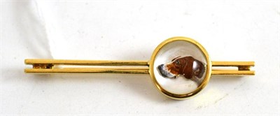 Lot 366 - A gold brooch with a painted crystal of a dog's head