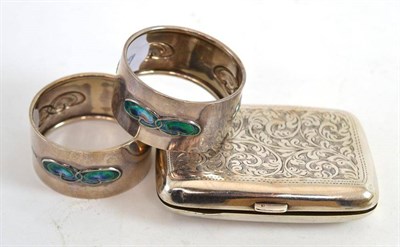 Lot 386 - A pair of silver and enamel napkin rings by William Hair Haseler, Birmingham 1906, together...