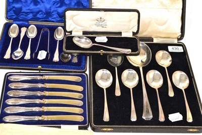 Lot 430 - A cased set of silver dessert spoons and serving spoon, Birmingham 1934; a cased set of silver...