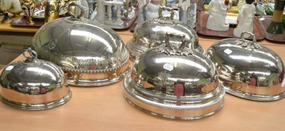 Lot 446 - A pair of late 19th century silver plated cloche or meat covers, each engraved with a coat of...