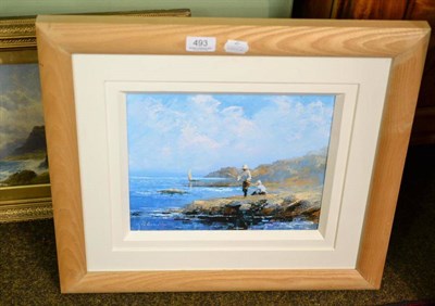 Lot 493 - M W Crawshaw (Contemporary) Two boys fishing on the rocks, signed, oil on board