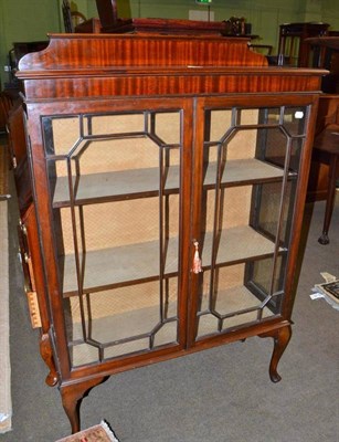 Lot 557 - A mahogany two door astragal glazed display cabinet