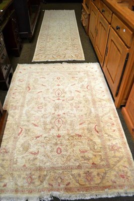 Lot 558 - A matched pair of narrow Afghan runners, North Afghanistan, each with a floral field enclosed...