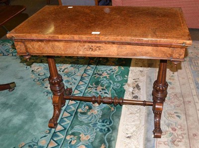 Lot 582 - A Victorian burr walnut fold-over swivel-top card table