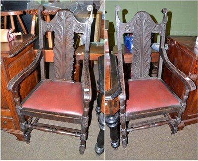 Lot 595 - A pair of Continental carved open armchairs