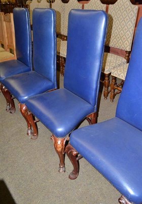 Lot 602 - A set of four blue leather-upholstered high-back side chairs on cabriole legs and a...