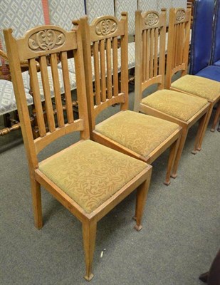 Lot 603 - A set of four blonde oak rail back dining chairs