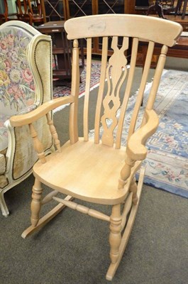 Lot 618 - A beech high-back rocking chair