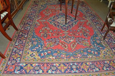 Lot 622 - West Persian Village carpet, the tomato field of flowering plants around a medallion framed by...