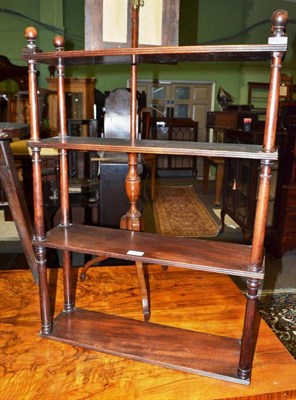 Lot 623 - 19th century four tier mahogany wall shelf