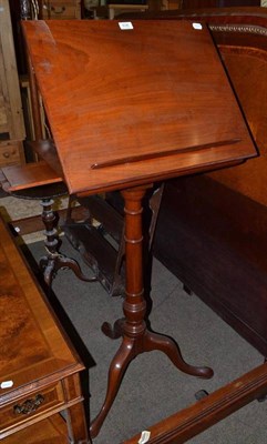 Lot 636 - A mahogany music stand on tripod support