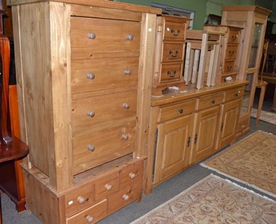 Lot 643 - A modern blonde oak dresser base, a glazed pine cabinet, a pair of pine bedside chests, two...