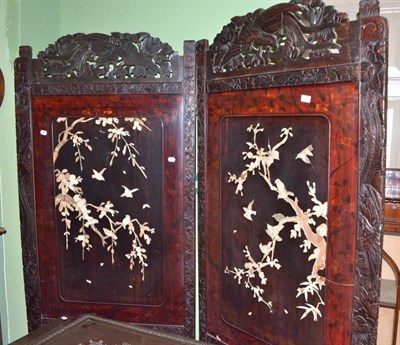 Lot 647 - A Japanese ebonised wood and lacquer two leaf screen with bone applique