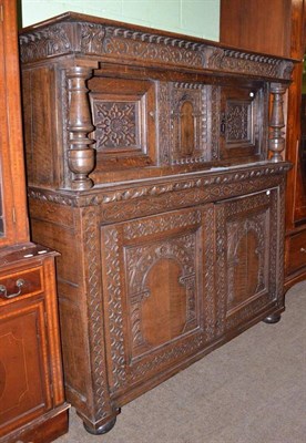 Lot 652 - An 18th century oak court cupboard