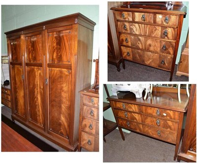 Lot 657 - A mahogany three piece bedroom suite with bead and reel decoration comprising a triple...