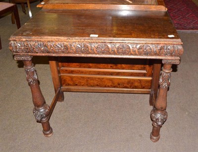 Lot 661 - A Continental carved oak side table