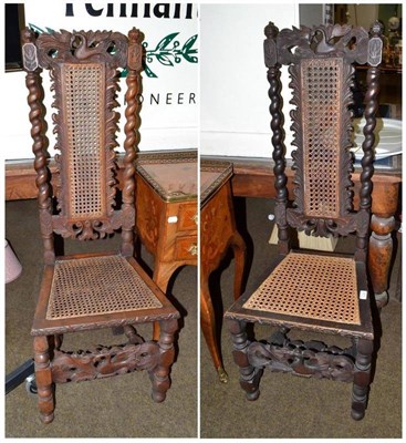 Lot 671 - A pair of 20th century carved oak hall chairs