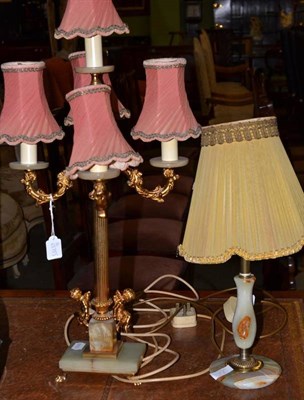 Lot 675 - A gilt metal and onyx four branch table lamp and a similar onyx table lamp