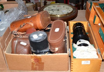 Lot 716 - An early 20th century circular chiming wall clock and a collection of assorted cameras and lenses