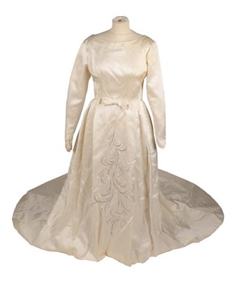 Lot 2111 - A 1962 Jean Varon Wedding Dress, in cream silk...