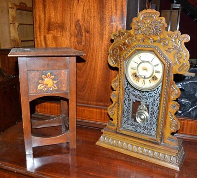 Lot 768 - An American shelf clock and an Arts & Crafts small table