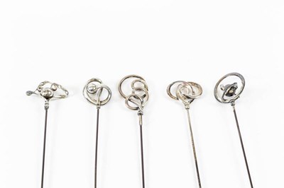 Lot 2193 - Four Assorted Charles Horner Silver Hat Pins,...
