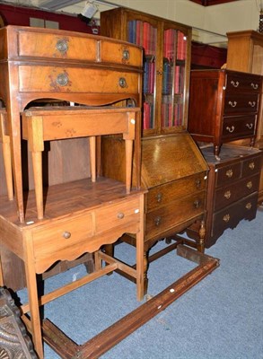 Lot 774 - An Edwardian four drawer chest, three drawer chest, oak bureau bookcase, two fire curbs, two drawer